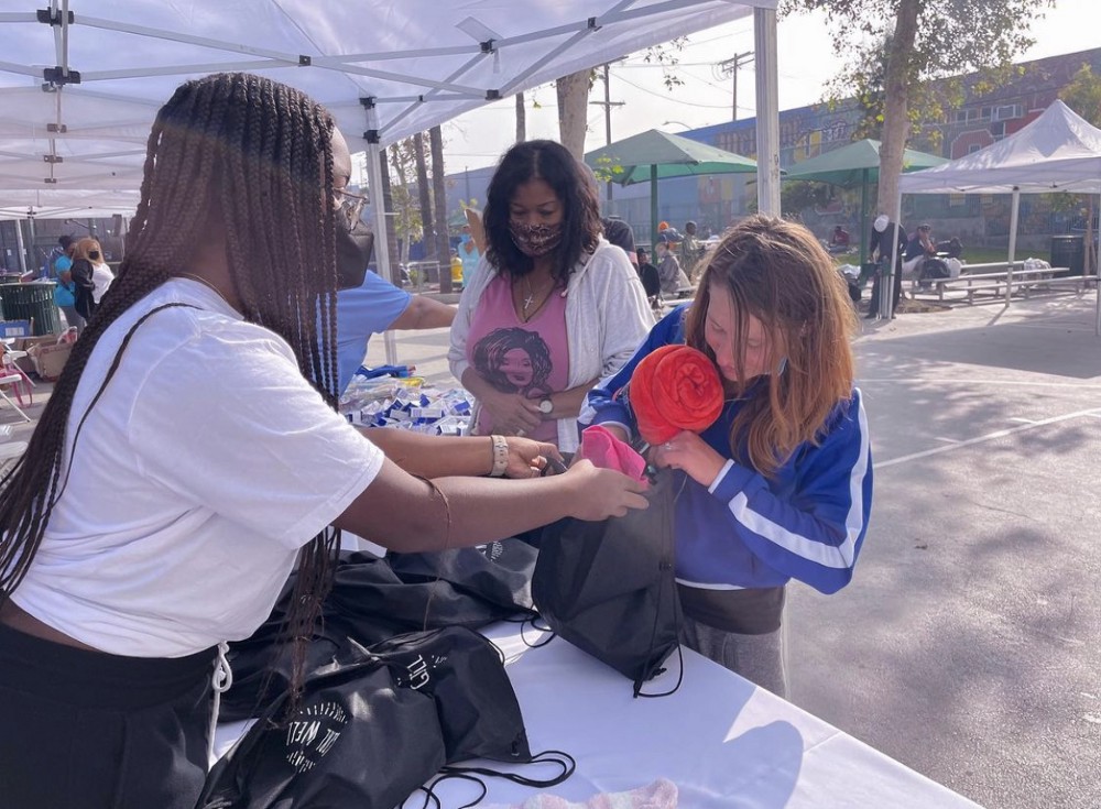 Girl gifting another girl a bag