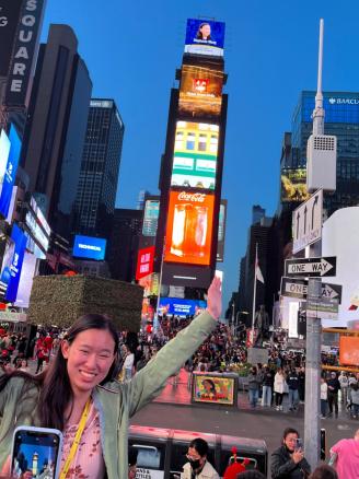 Girl at New York Times Square smiling