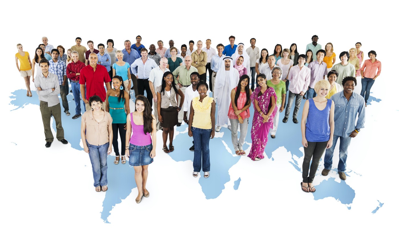 A lot of people standing on the map of the world