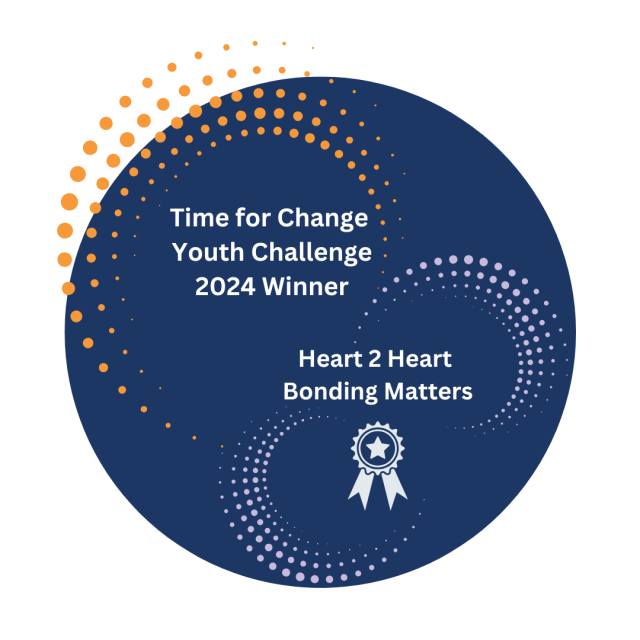 Dark Blue Circle with Orange and Purple dots, white medal, white text reading: Time for Change Youth Challenge 2024 Winner Heart 2 Heart Bonding Matters