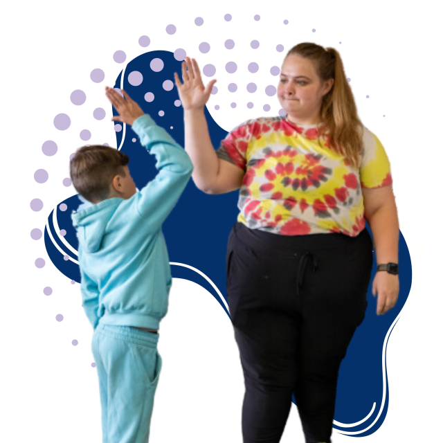 A photo collage of a female teacher wearing a tie-die shirt high-fiving a young boy in a blue track suit. The image is overlayed over graphical elements–an odd blue shape with concentric lilac dots.